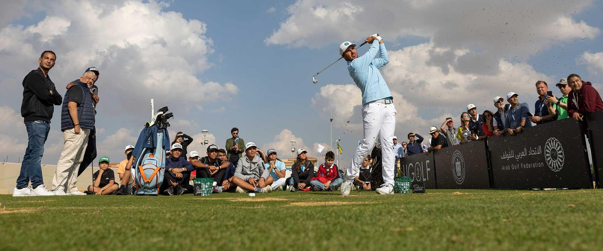 Youngsters learn from the best as Koepka and Issa take part in special clinic